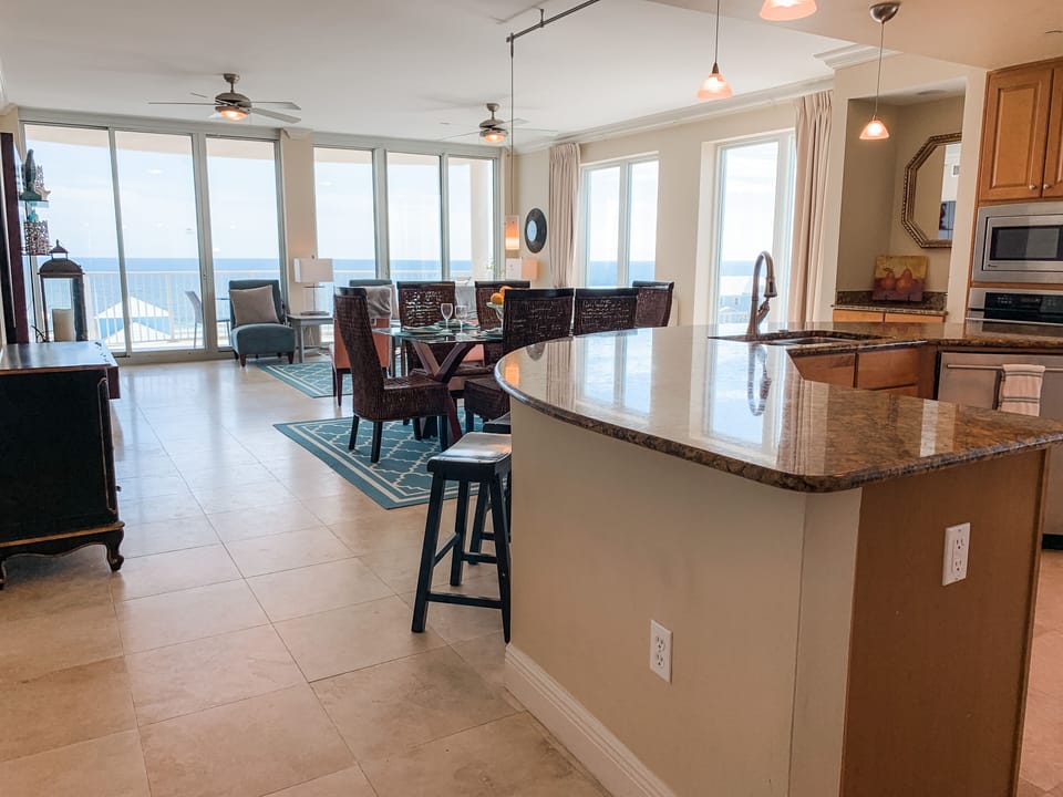 Family room with wraparound views & dual doors to patio. Lovely open floor plan!