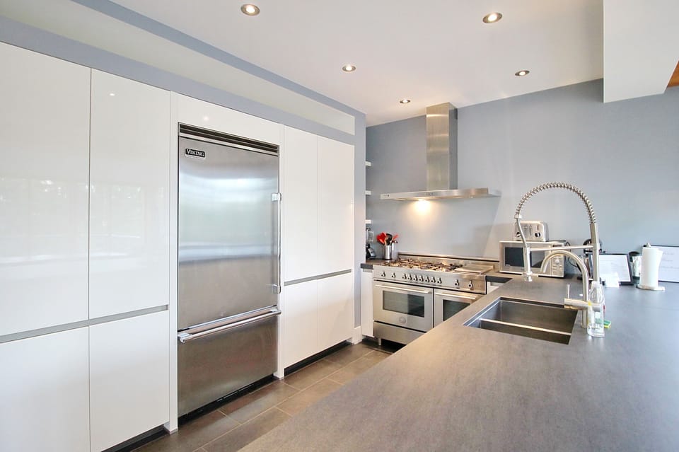 Chef’s kitchen with double oven, dual sink, dishwasher, Viking refrigerator
