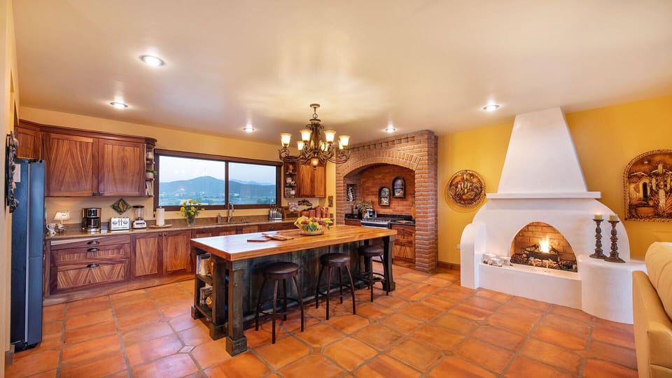 Grand South Chef's kitchen 360 sq. ft. with gas log fireplace and mountain view.