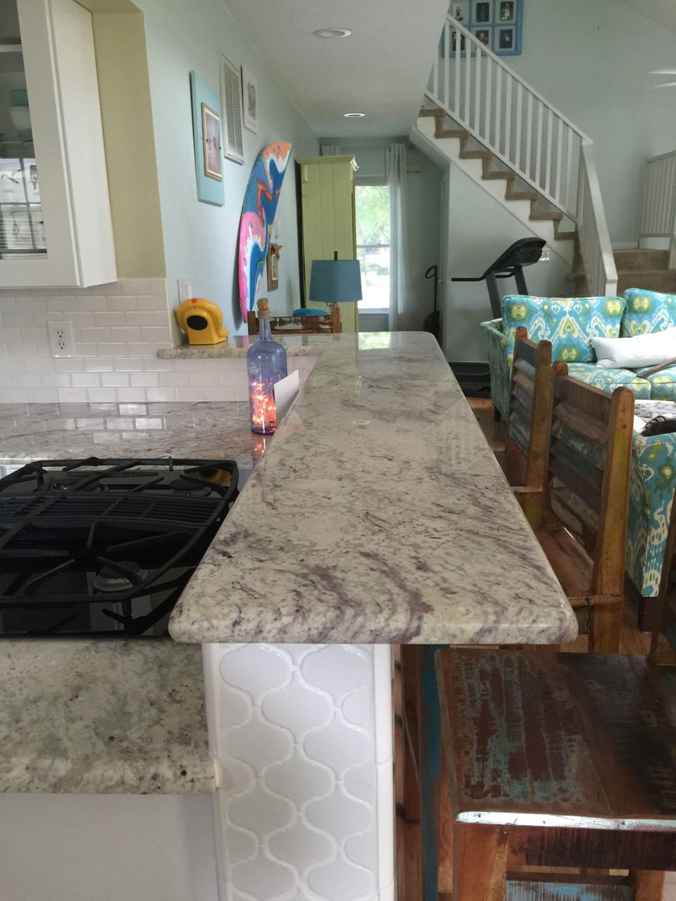granite countertop eating area with 4 benches