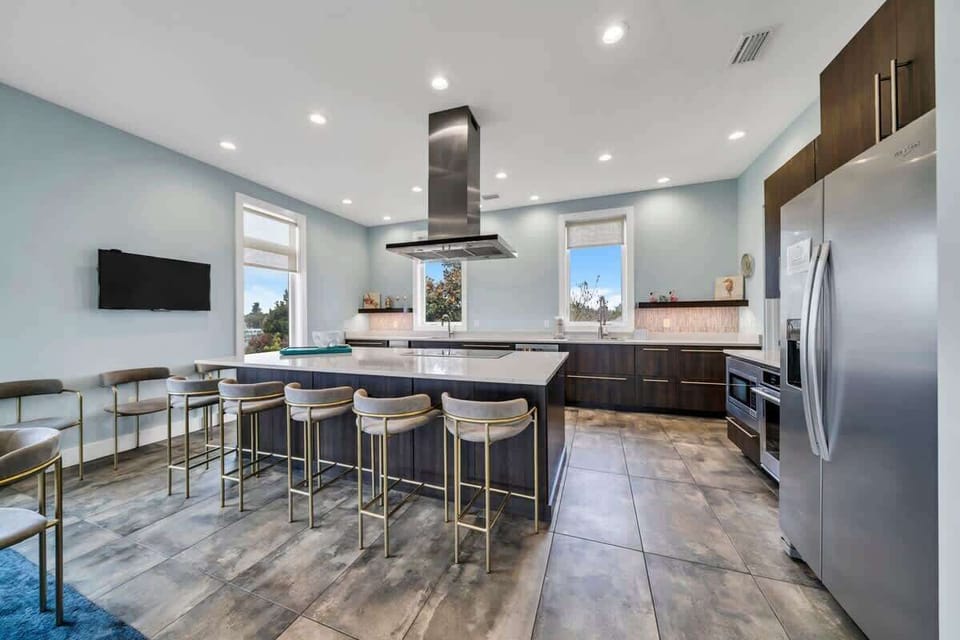 You Won't Miss Your Favorite Show From This Kitchen, Not Only Can You See The Main Living Room TV, But You Have A TV Just Off The Kitchen Island