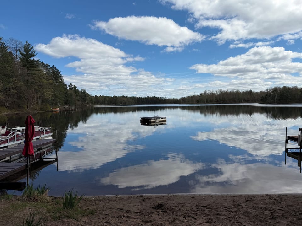 A sandy beach & pristine waterfront view, swim, fish, or a paddle await you