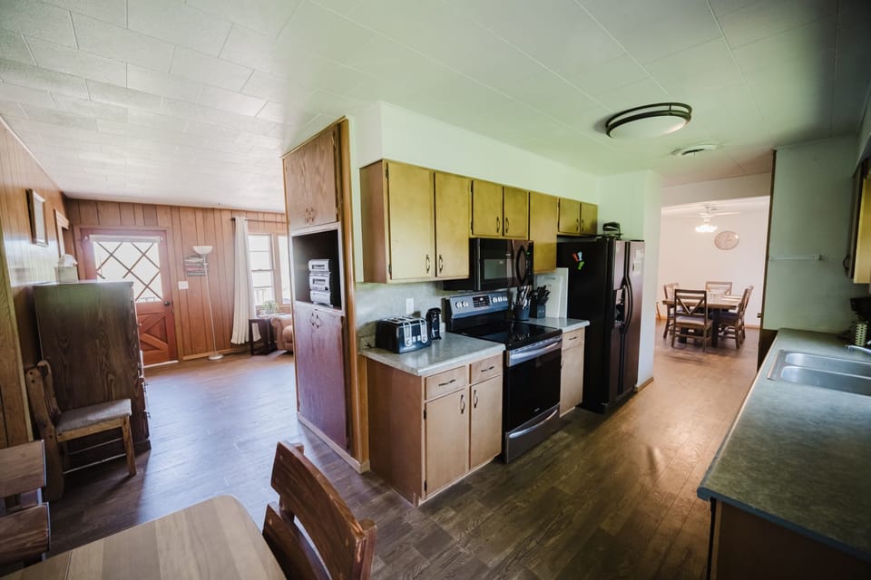 The galley kitchen is fully stocked with pots/ dishes, appliances.  