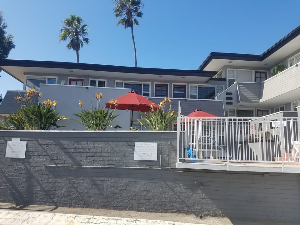 Gated jacuzzi on patio. Parking spot #10 is to the far right of this gate.