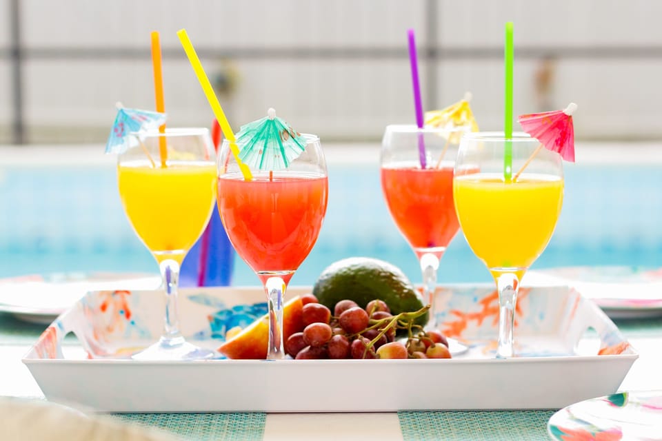 Enjoy a beverage of your choice while relaxing by the pool.