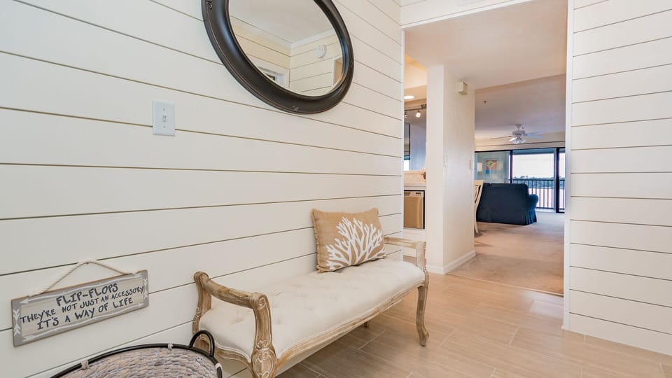 Entryway with shiplap and nautical décor greet you. 