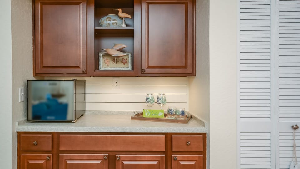 Fully stocked bar area with wine fridge 