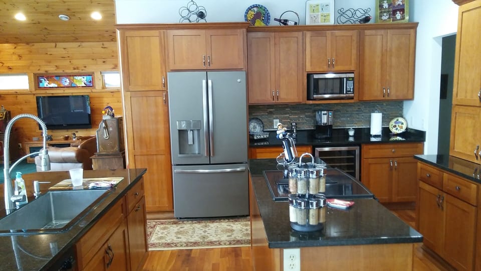 Open concept kitchen with granite counter tops.  Be part of the party and cook.