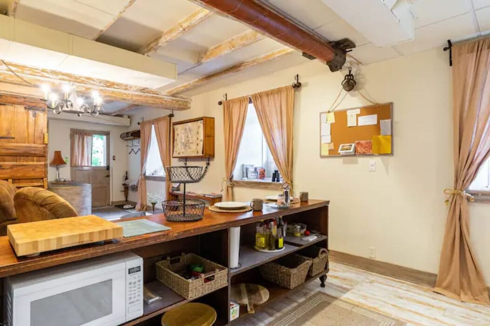 The antique oak counter for cooking basics, prep & for dining on opposite side.