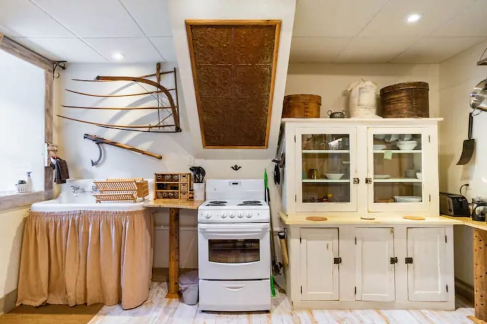 A full farmhouse style kitchen with all the basics provided for easy meal prep.