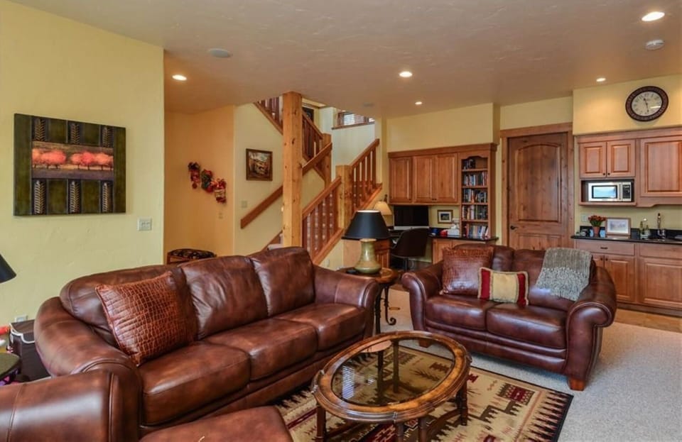 Downstairs living area; mini kitchen on right; 2nd laundry room thru door