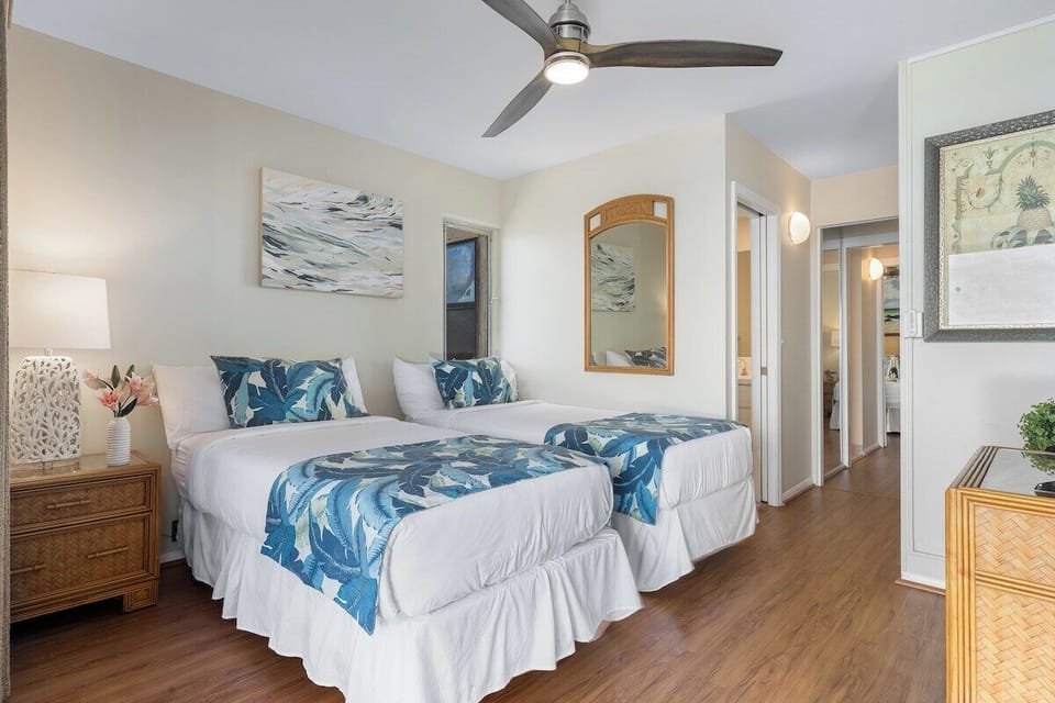 our peaceful getaway—twin beds and a private balcony overlooking the ocean