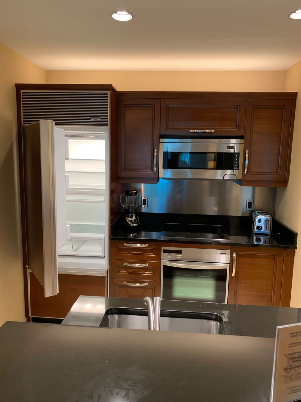 Kitchen with Appliances, dishes, cookware. 