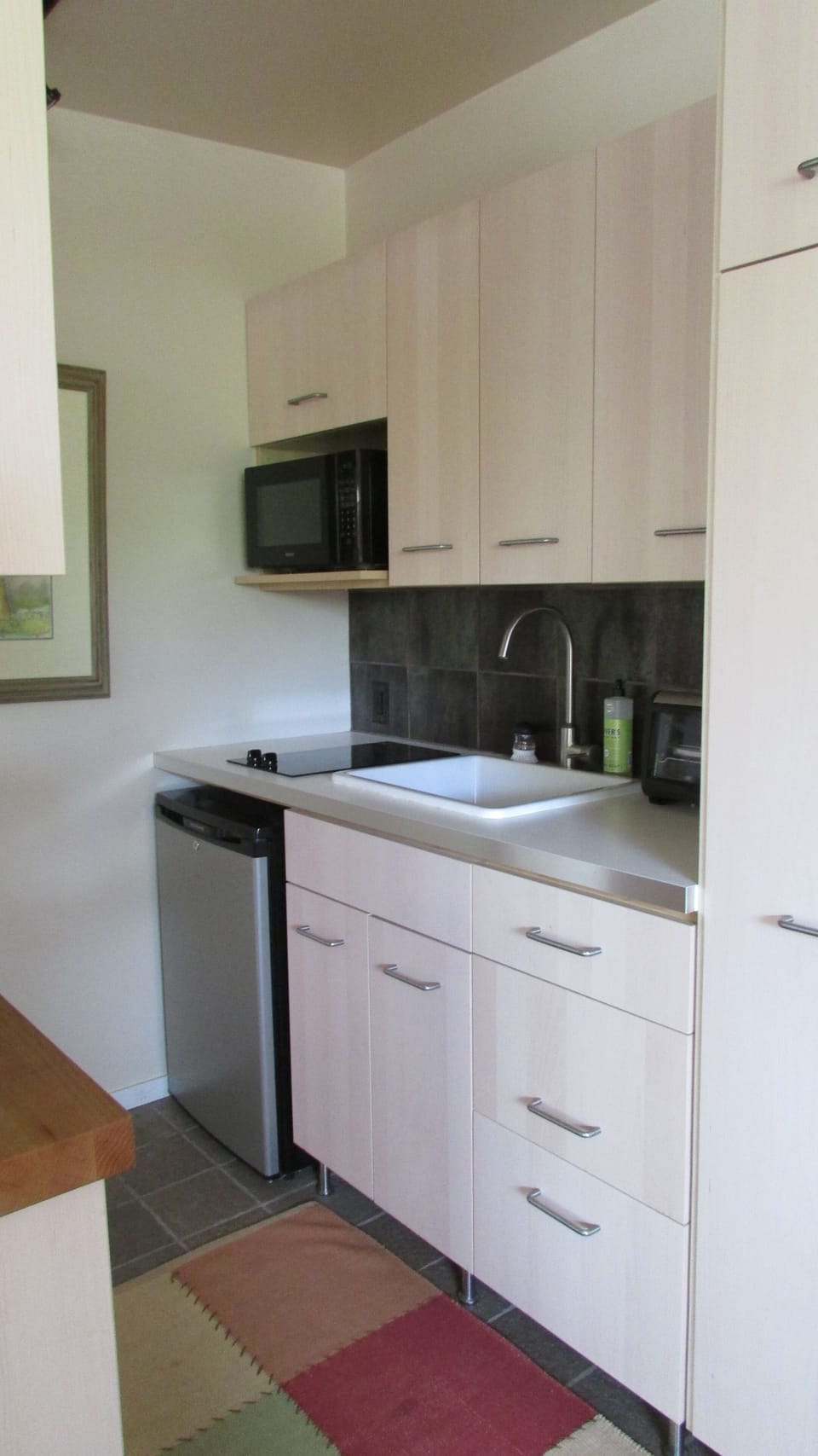 kitchen with 2 burner cooktop, microwave, Keurig, toaster oven