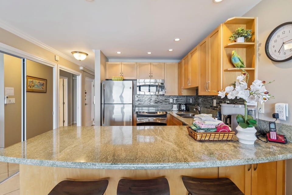 Kitchen - Additional bar seats for three people.