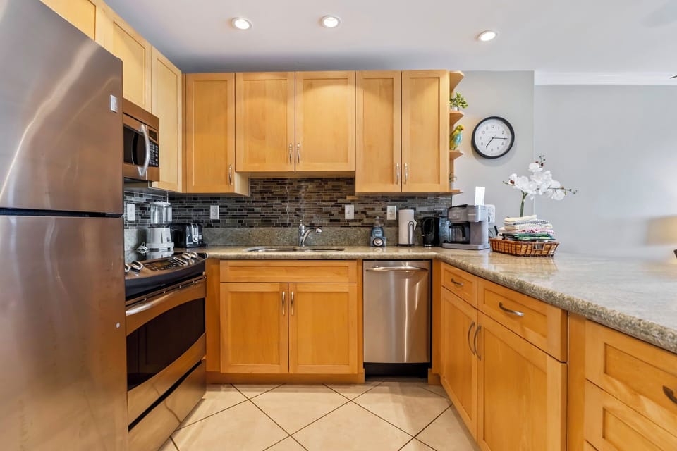 Kitchen - Stainless steel appliances including dishwasher for easy clean up.
