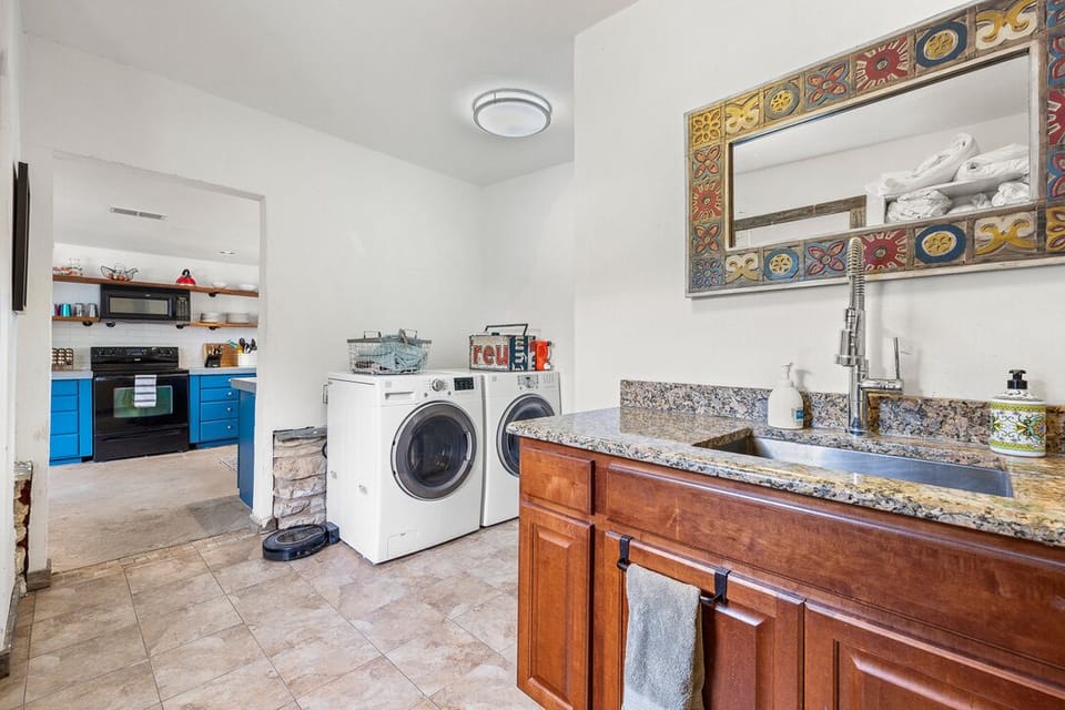Laundry room with half bath. 