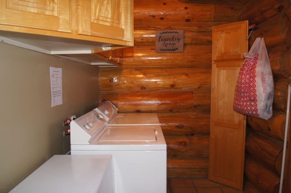 Full sized washer & dryer off kitchen. Trash compactor between kitchen & laundry