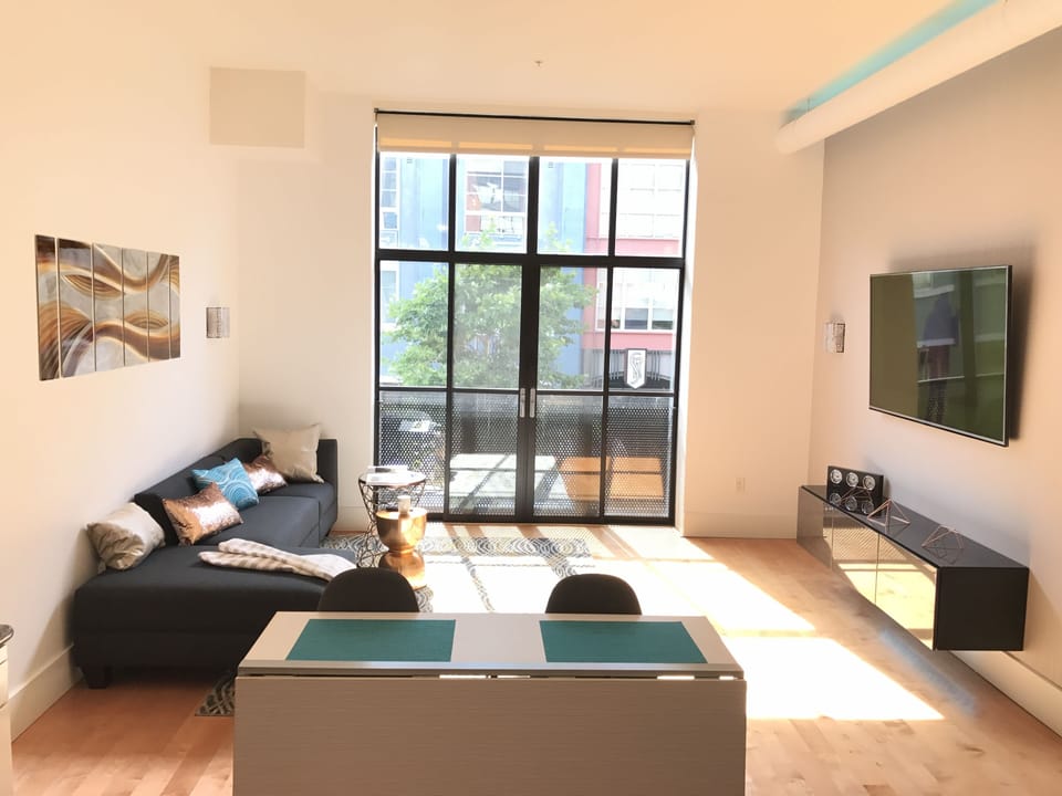 Living room with 65" TV with streaming capability.
