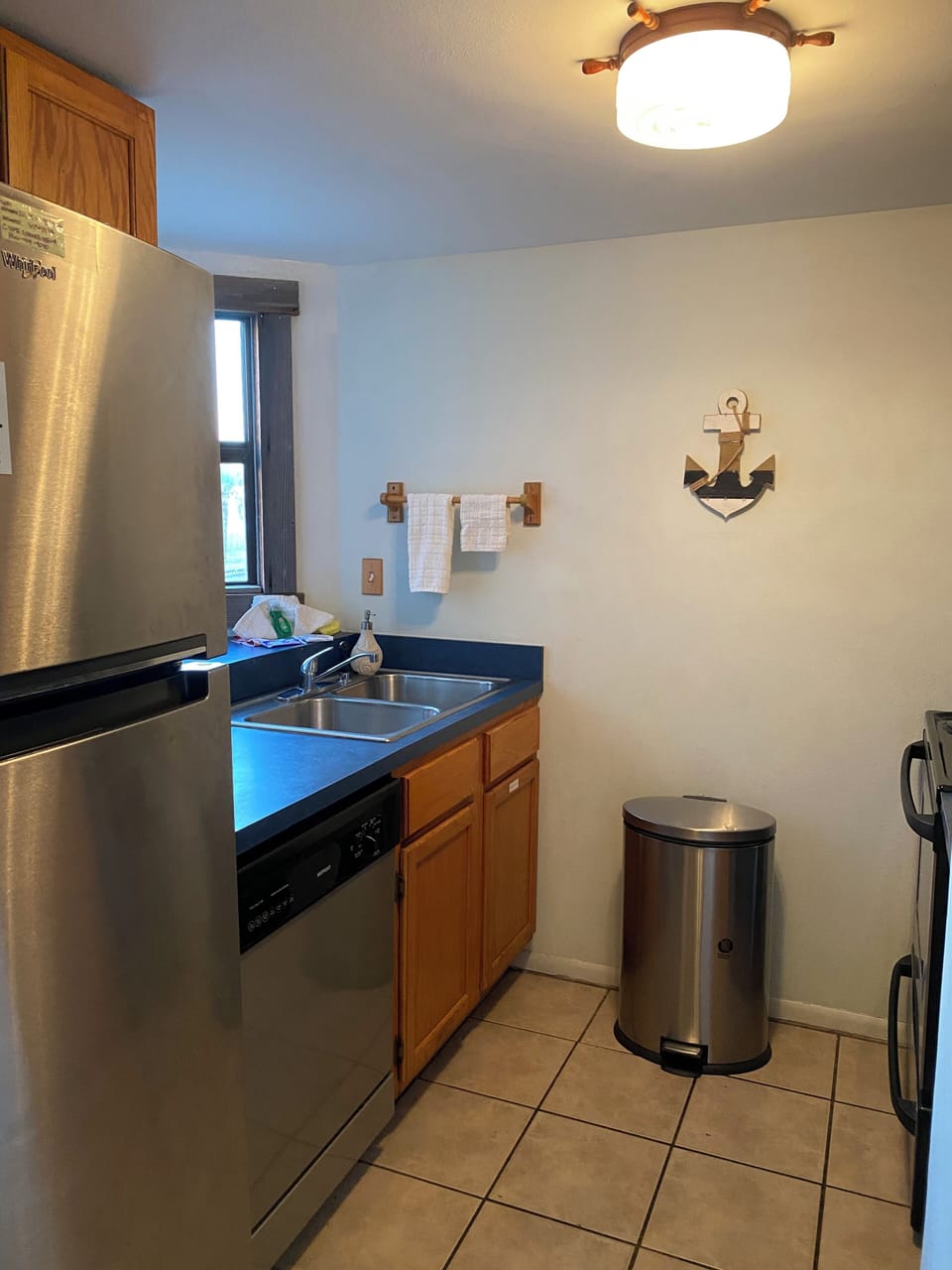 Kitchen has dishwasher, oven, stove, microwave and refrigerator.
