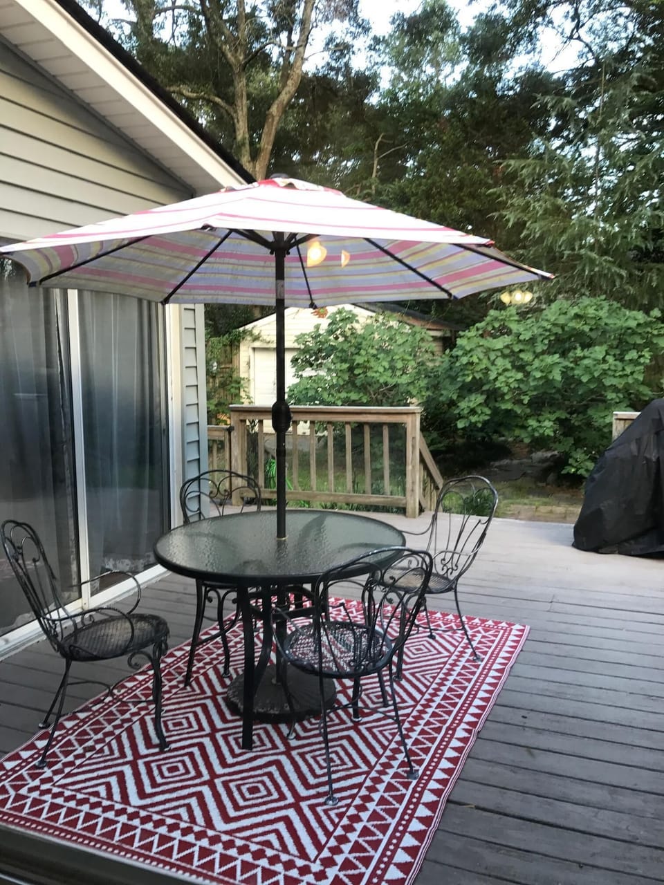 Cozy outdoor patio with gas & charcoal grills for relaxing and entertaining 