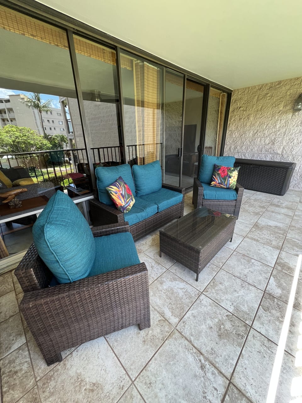 Tiled Full Length Lanai, Soft Cushioned Wicker Furniture, Beach Bin