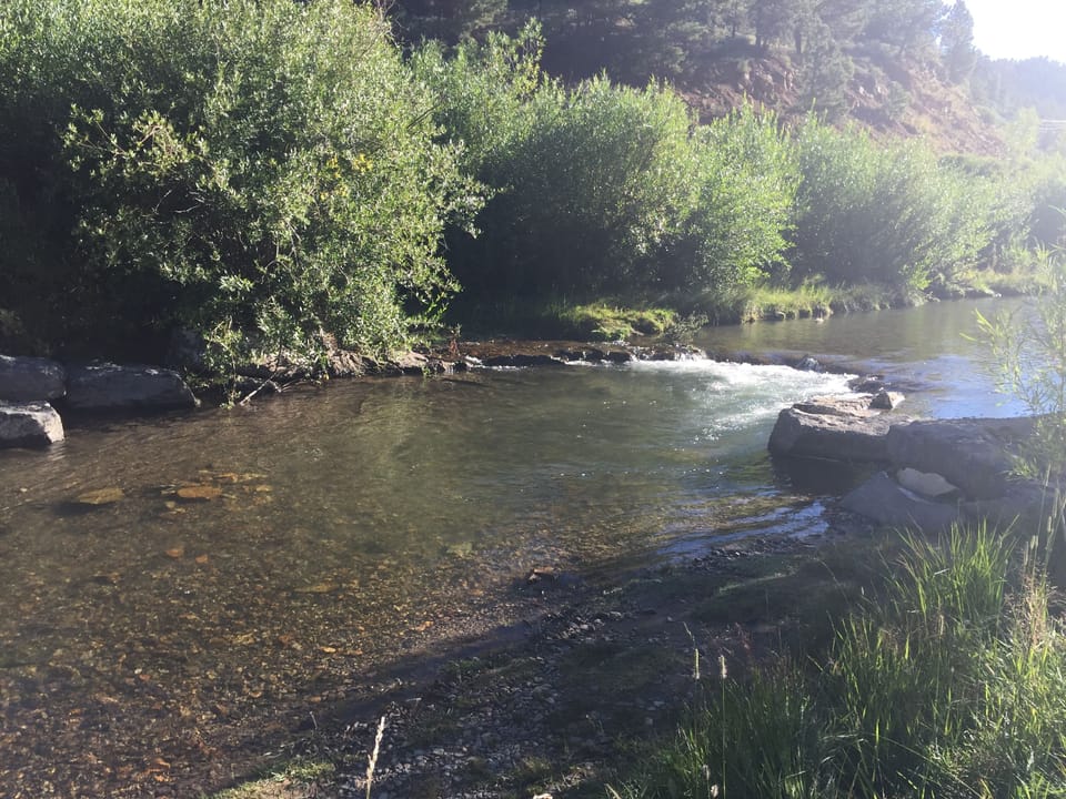 River and fishing park across the street