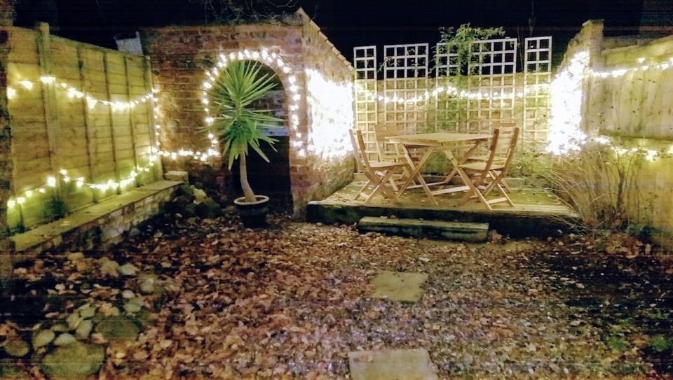 Private courtyard garden has fairy lights - ideal for a relaxing evening