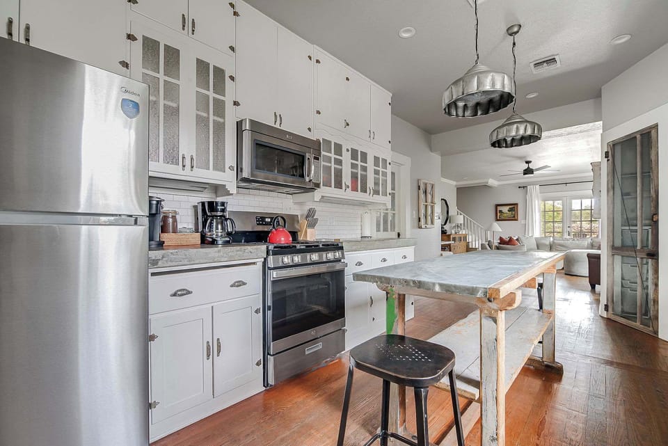 Kitchen includes an oven, microwave, full fridge and coffee maker.