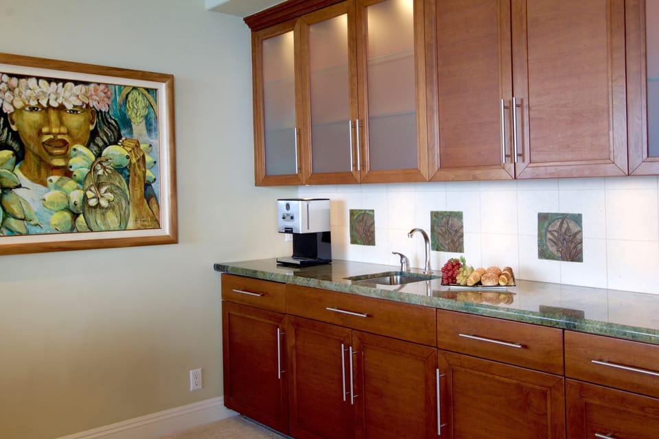 Coffee maker, mini fridge, sink, microwave and music center of the master suite 