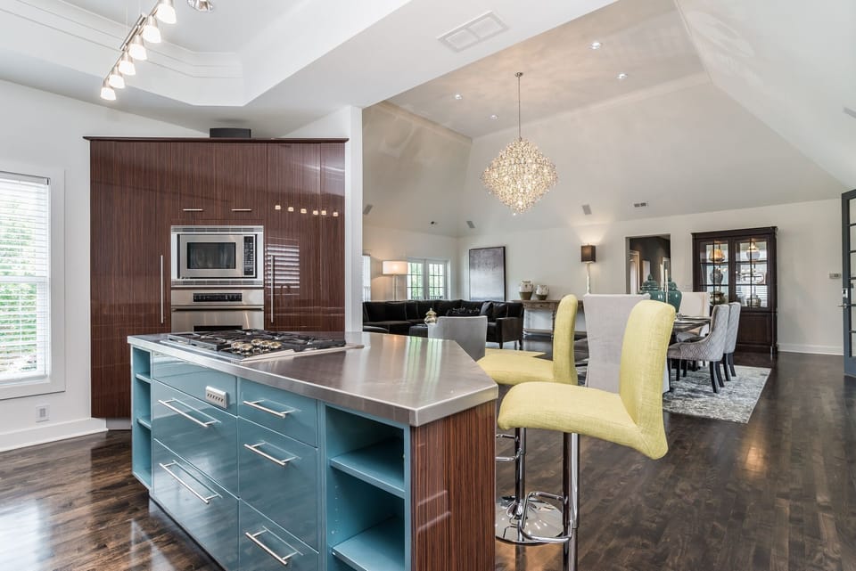 View of Kitchen looking into the Grand living Room with 16’ ceilings 