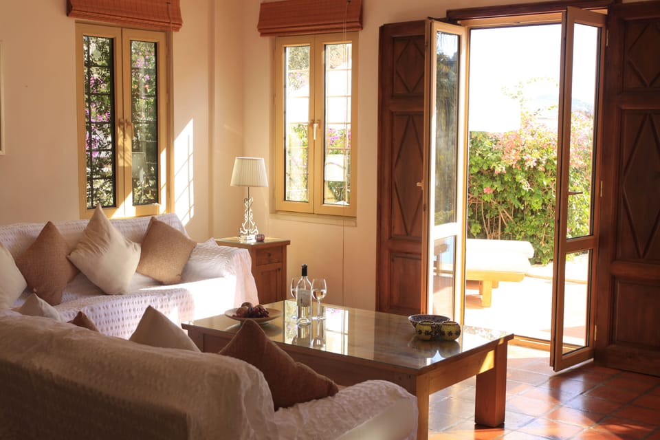 living room with French doors out to pool terrace