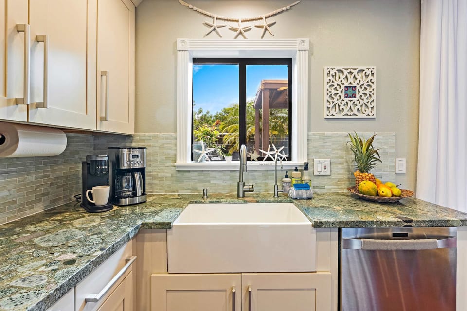 Enjoy the convenience of a fully equipped kitchen that blends functionality with tropical style.