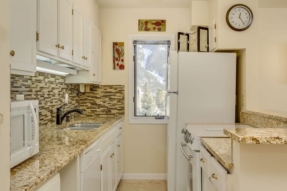Stainless steel sink and lots of counter space in the well-equipped kitchen.