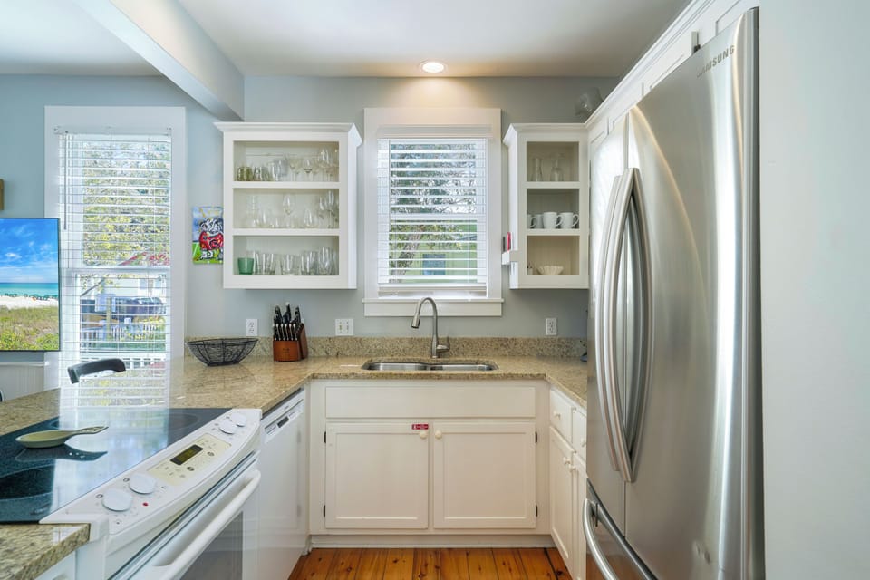 UPDATED KITCHEN WITH STAINLESS REFRIGERATOR