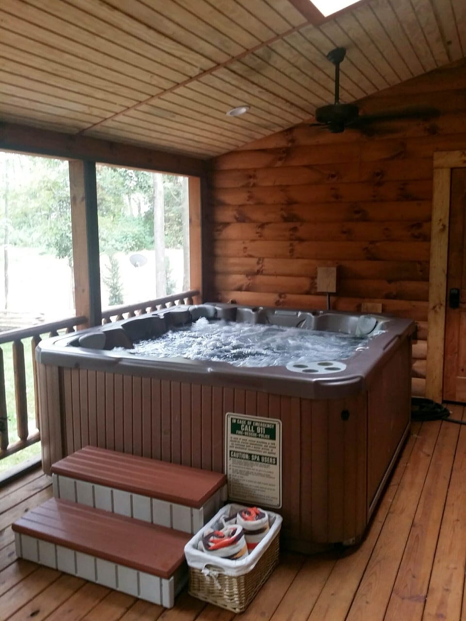 Hot Tub on back screened in porch area