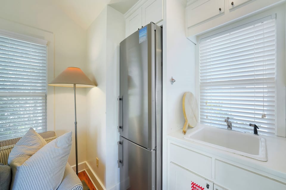 ALTERNATE VIEW OF KITCHEN WITH STAINLESS STEEL FRIDGE