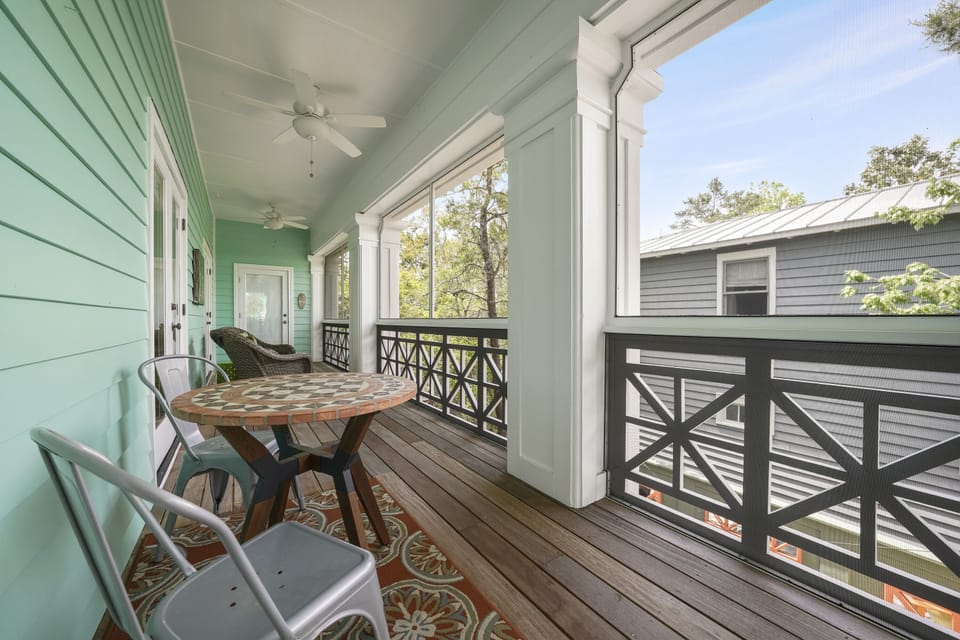 UPSTAIRS PORCH ALTERNATE VIEW W/BISTRO AREA IN CENTER