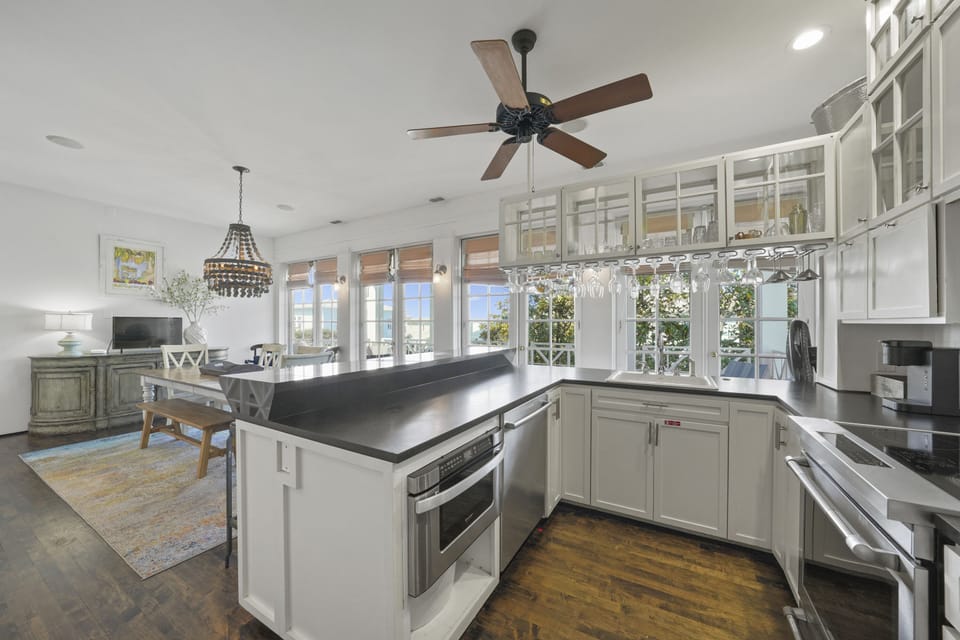 KITCHEN W/SLEEK BLACK COUNTERS, ALL STAINLESS STEEL APPLIANCES