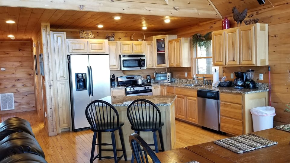 Kitchen with stainless steel appliances and granite countertops