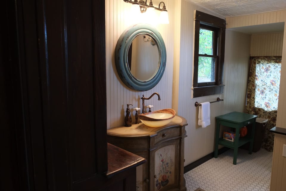 Lower level bathroom two with full size shower, washer and dryer and linens.