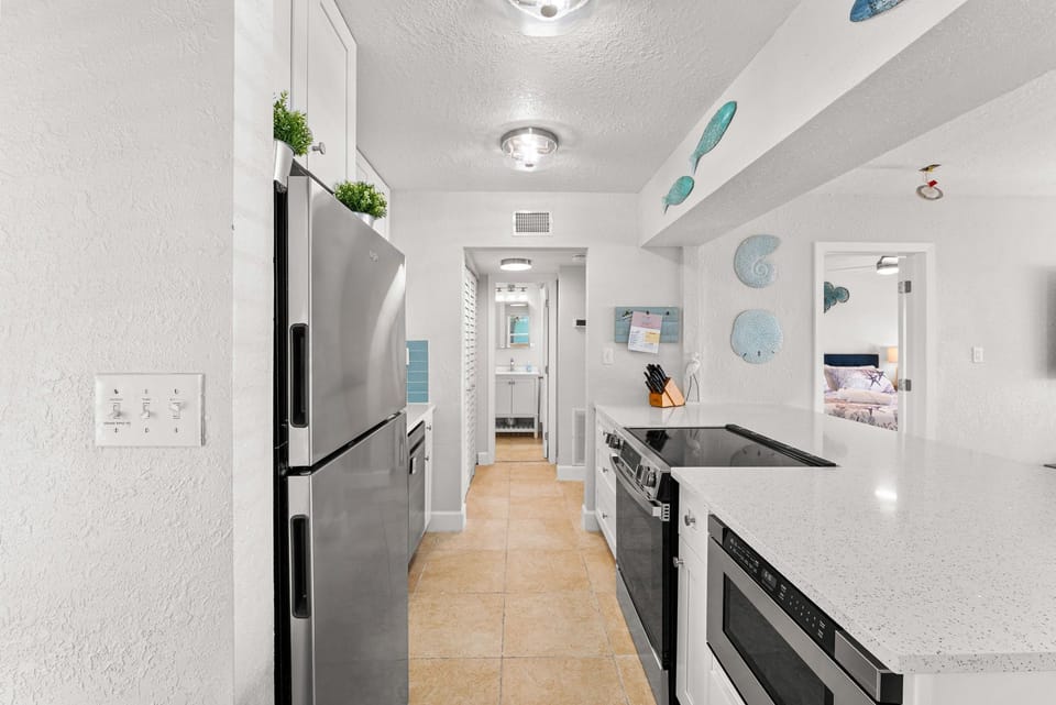 Fully equipped kitchen with a Nespresso, Keurig, drawer microwave, & dishwasher