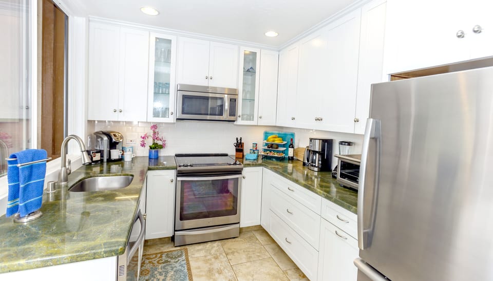 The bright ocean view kitchen has everything you need to prepare delicious meals