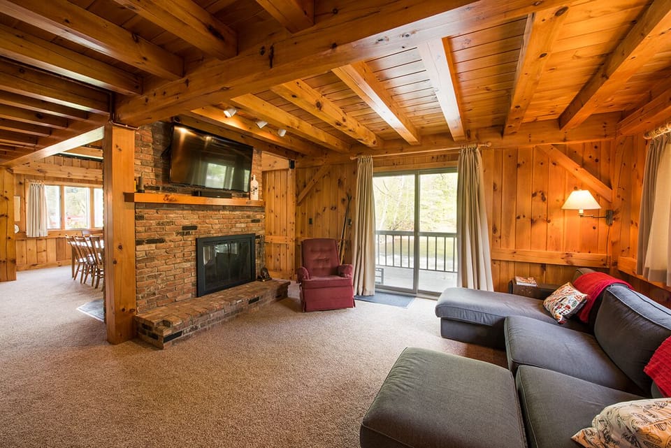 Living Room with access to deck through patio doors, and views of Lake Pauline. 
