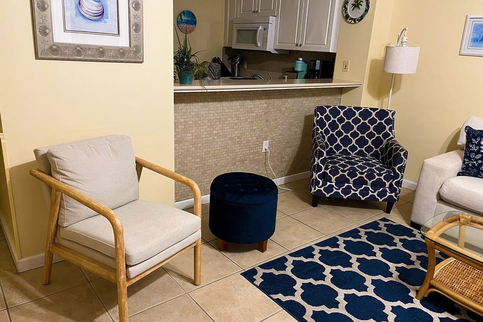 Kitchen breakfast bar pass through allows views of the gulf