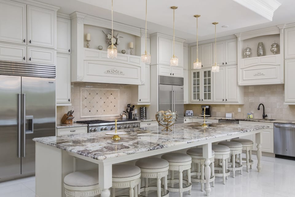 The upgraded kitchen has double appliances, ample granite counter space and breakfast bar seating