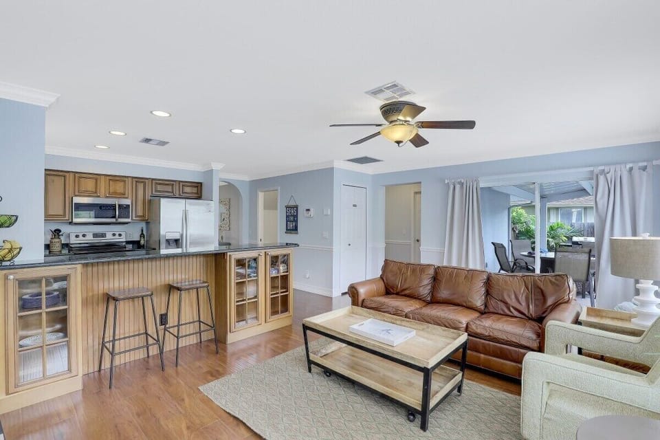 Open concept kitchen and family area featuring a breakfast bar