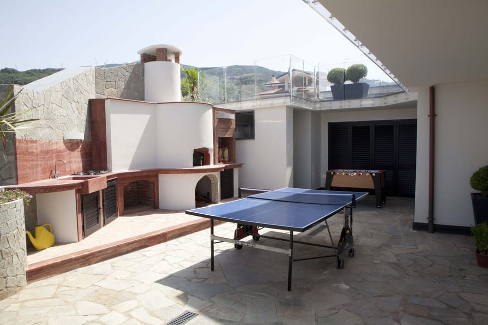 Games area and pizza oven/BBQ corner