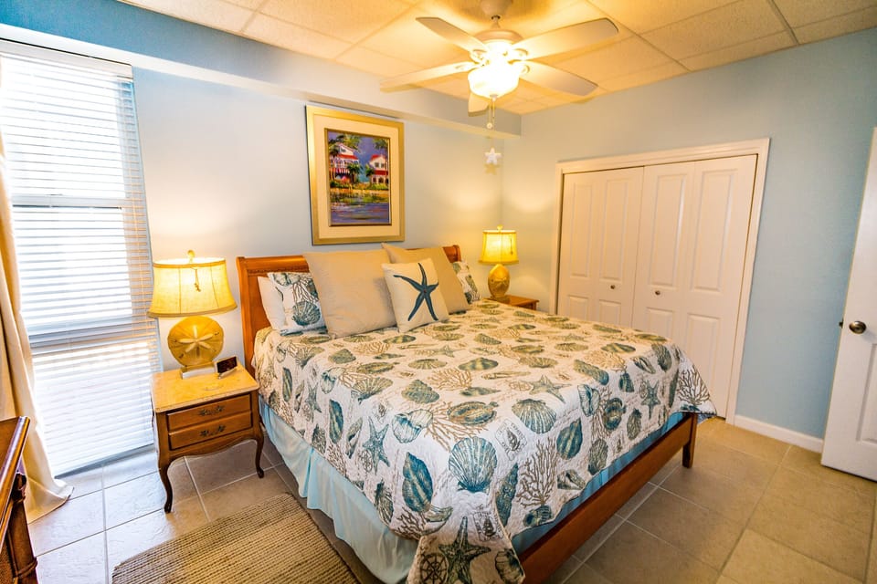 King size bed with private bath and 42" flat screen Smart TV mounted on the wall