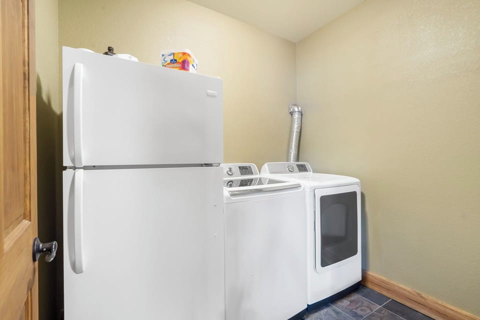 Laundry room with extra fridge on the lower level